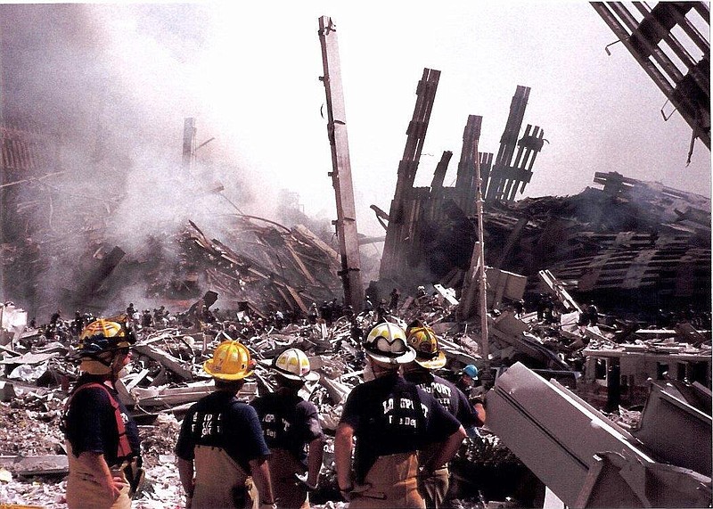 From left, firefighters Tom Adams, Bill Stinson, Jim Leeds, Dan Adams and Chris Ricciotti at the World Trade Center Thursday, Sept. 13, 2001.   