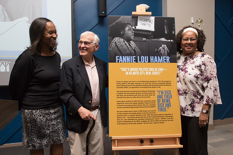 Professor of Communication and Africana Studies Donnetrice Allison, Professor Emeritus of Philosophy and Religion Joseph  Walsh and Distinguished Professor of Social Work and Africana Studies Patricia Reid-Merritt with the plaque that will hang outside the new Fannie Lou Hamer Event Room at Stockton University Atlantic City.