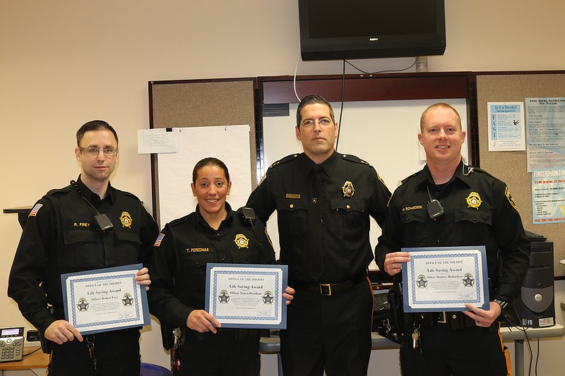 From left, Sheriff's Officers Robert Frey, Tanya Perendnas, Sheriff Eric Scheffler and Officer Matthew Richardson.  Not pictured. Officer Dalton Rodriguez.