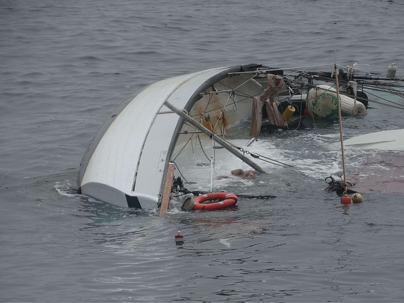 Courtesy U.S. Coast Guard District 5/The crew of Coast Guard Cutter Lawrence Lawson, a 154-foot fast response cutter homeported in Cape May, approaches a capsized 55-foot wooden sailboat about 65 miles east of Atlantic City, May 29. An aircrew from Coast Guard Air Station Elizabeth City, North Carolina, rescued two mariners, who they found clinging to the capsized boat's hull. 