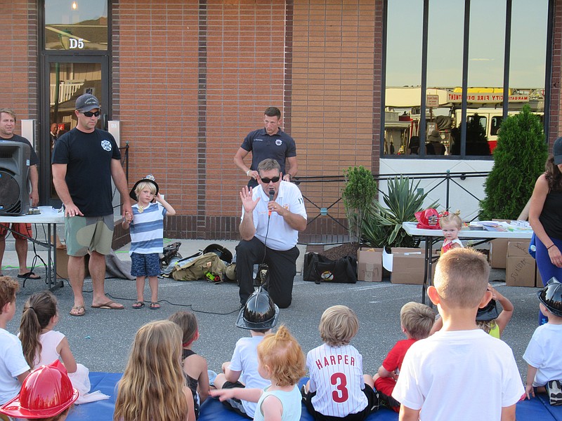 Margate City Fire Chief Dan Adams shares some basic fire safety tips with children at the department's annual open house at the library.