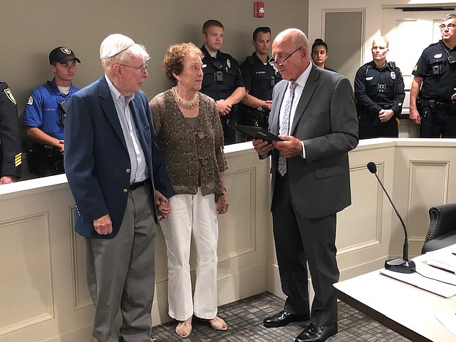 Margate Mayor Michael Becker, right, honors former OEM Coordinator Jerry Greenberg and his wife Myra for their dedication to the city.