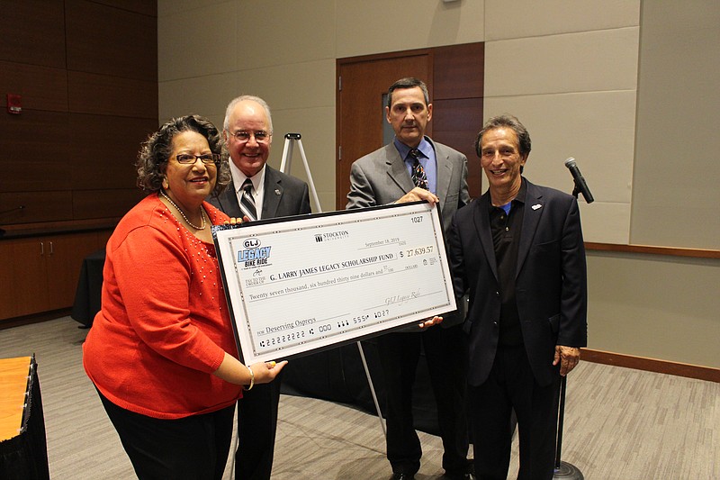 From left, Cynthia James, Stockton President Harvey Kesselman, and ride organizers Craig Stambaugh and Arnaldo Cordero-Roman.