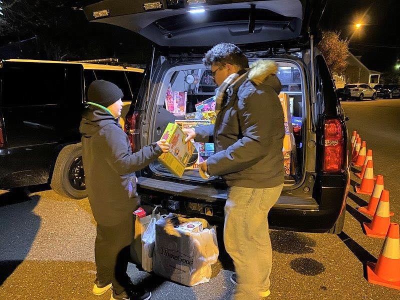 Volunteer Colin Fuentes of Ventnor collects toys for distribution by the Atlantic County Toys for Kids program.