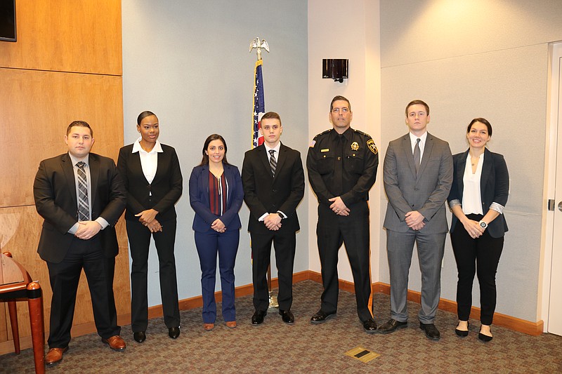 From left, Mario Scottodivetta, Alexis Gibson, Victoria Albo, Bryan Martyn, Sheriff Eric Scheffler, Thomas Reilly and Elissa Vasquez-Croce 
following administration of their oaths of office.