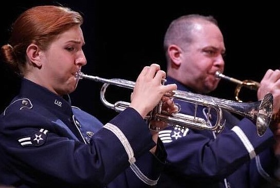 Airman First Class Sally Tepper and Staff Sergeant Andrew Fowler perform with the Falconaires at the ENT Center in Colorado Springs in November 2018.