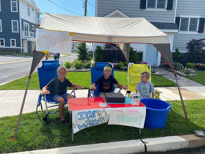 Longport's Alex, Asher and Ace Goldberg are selling ice cold water to raise money for CHOP.