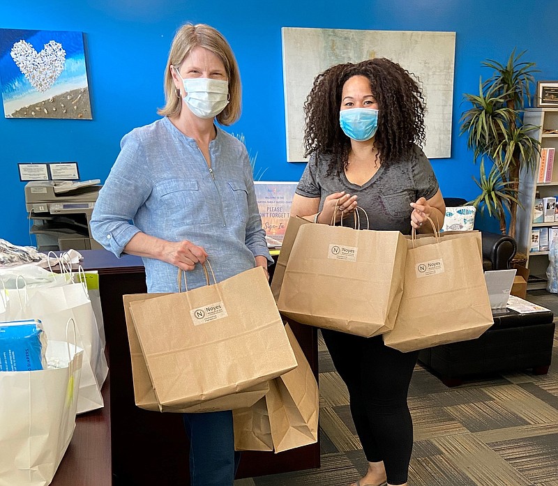 Noyes Museum of Art Director of Education Saskia Schmidt delivers art kits to Oceanside II Family Service Center Program Supervisor Atisha Herring.