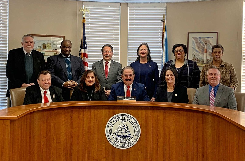 Atlantic County Board of Freeholders
Seated from left, Freeholders John W. Risley Jr., Amy L. Gatto, Chairman Frank D. Formica; Vice Chairwoman Maureen Kern; and Freeholder Richard R. Dase.
Standing, Solicitor Roger Steedle, Freeholders Ernest D. Coursey. James A. Bertino, Caren L. Fitzpatrick and Ashley R. Bennett, and Clerk to the Board Sonya G. Harris.