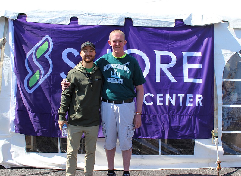 Stephen Jones, right, a Shore Medical Center employee and big Eagles fan, was honored Oct. 7 with JEVS Human Services' Inspiration Award. Jones is pictured with Philadelphia Eagles kicker Jake Elliott at Shore's health fair at the 2018 Somers Point Bayfest. 
