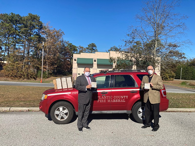 Pictured are Atlantic County Director of Emergency Management Mike Fedorko (left); and Ken Mosca, public affairs manager, Atlantic City Electric. Through its Emergency Services Partnership Program, Atlantic City Electric recently donated 350 smoke alarms to Atlantic County.