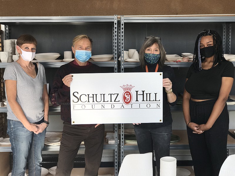 The Schultz-Hill Foundation grant will help the Mudgirls Studio continue its mission of empowering disadvantaged women through art. From left, Maryanne Mulhern, Gary Hill, MudGirls Founder Dorrie Papademetriou and Tajah Gay.