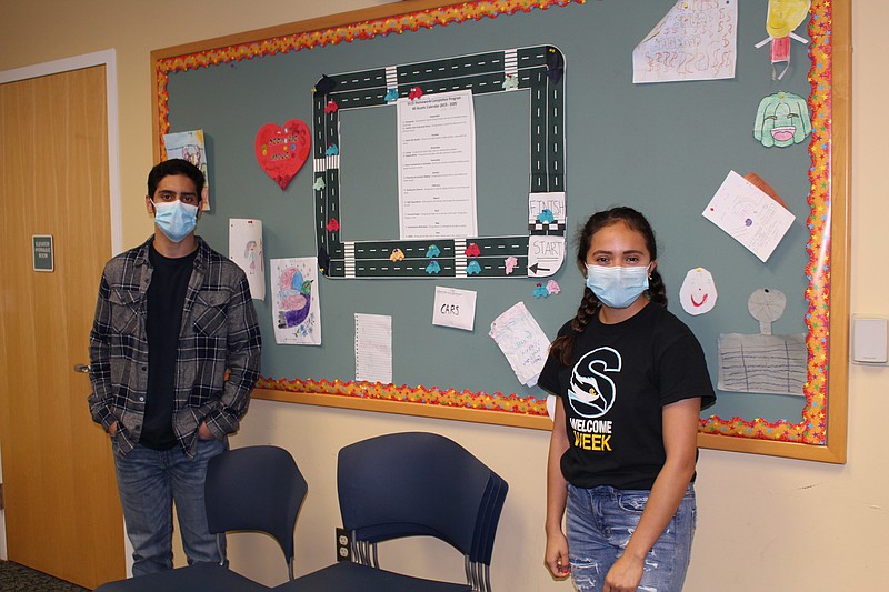 Provided/Hari Acharya of Mays Landing and  Ariana Ramirez of Northfield are among the Stockton University student tutors participating in the After-School Homework Completion Program sponsored by Stockton's Center for Community Engagement and Service Learning. 