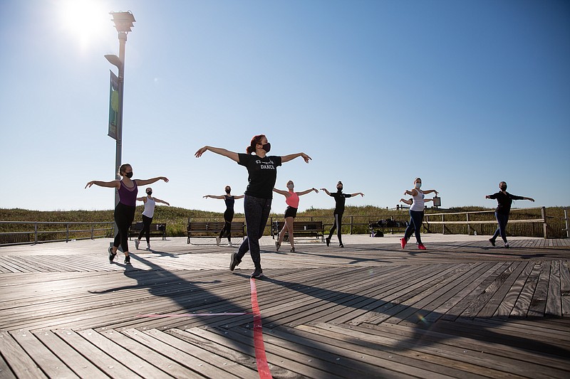 Photo by Susan Allen Stockton University/Associate Professor of Dance Rain Ross' ballet class practicing on the Boardwalk in October 2020. 