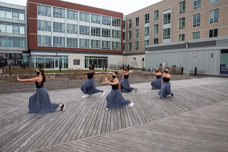 Stockton University dance students perform on the Boardwalk in front of the Atlantic City Campus.