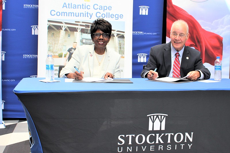 Stockton/Atlantic Cape Community College president Barbara Gaba and Stockton University President Harvey Kesselman sign the 2+3 MBA agreement at the Stockton University Atlantic City campus July 27. 