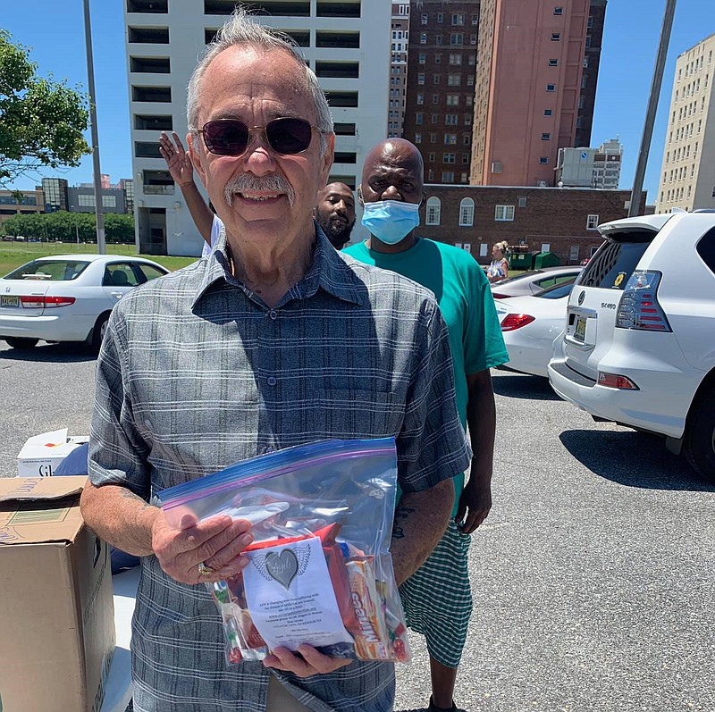 NJ Assemblyman John Armato helps distribute blessing bags.