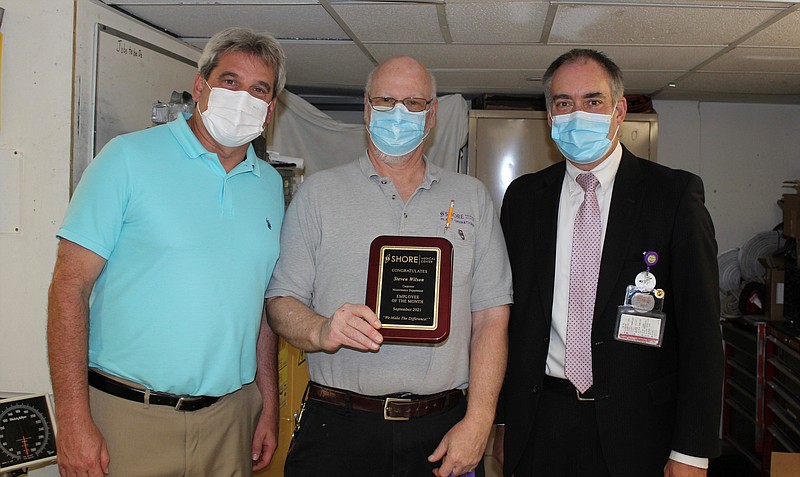 Shore Medical Center September Employee of the Month, Steve Wilson, center, with Director of Plant Operations Brad Foltz, left, and Administrative Director of Logistics and Finance Bob Robertson.