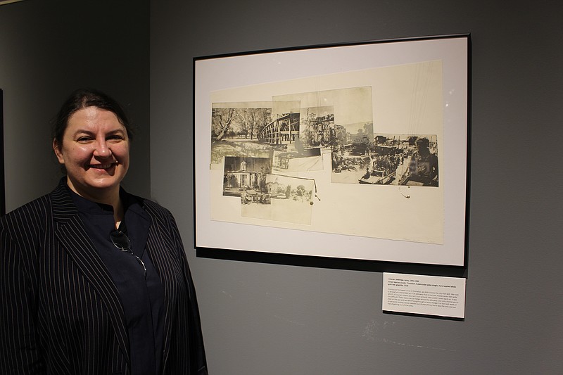 Stockton Associate Professor of Art Mariana Smith with artwork she created for the Experience Veterans and Artists Collaboration exhibit at the Stockton University Art Gallery. (Photo by Diane D'Amico/Stockton University) 