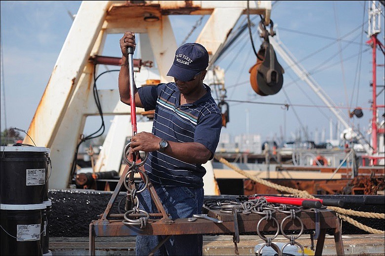 New Bedford Port Authority/A worker tends to scallop gear in New Bedford Harbor. The Atlantic scallop industry is the most economically valuable wild-caught federal fishery in the highest value fishing port in the nation. 