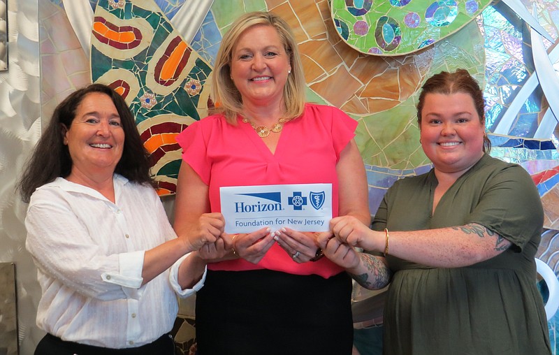 Provided/The Horizon Foundation for New Jersey Senior Program Officer Jennifer Goudy (center) presents a $45,000 check to Sharon Simon, Rothenberg Center for Family Life Supervisor at JFS (left) and Caelin McCallum, JFS Director of Healthy Community Initiatives to support the agency's Wellness Network. 