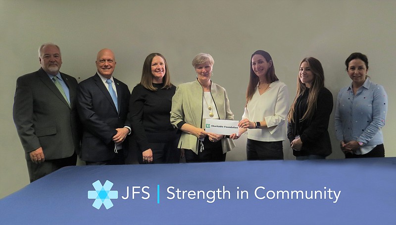 Provided/Paige Carlson-Heim (fourth from left), of TD Charitable Foundation presents a $150,000 check to Jewish Family Service CEO Andrea Steinberg as part of the Housing for Everyone grant. 