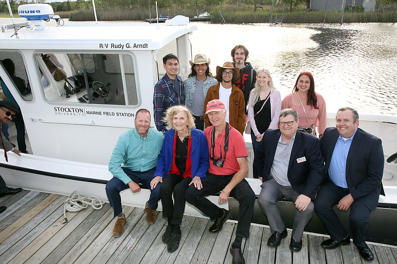 Photo by Vern Ogrodnek of Nicholas and Partners/ Seated from left, Steve Evert, Judy Arndt, Alex Oppedyk, Peter Straub and Dan Nugent with students in the marine sciences program at Stockton University on the new R/V Rudy G. Arndt that was purchased with funds donated by Judy in memory of her late brother, Rudy G. Arndt, a professor at Stockton. 