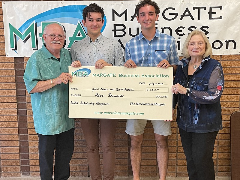 The Margate Business Association held a scholarship awards ceremony at the Margate City Public Library, July 12. From left, Daniel Walters, John Alice of Mainland Regional High School, Robert Fishbein of Atlantic City High School and Maria Walters. 