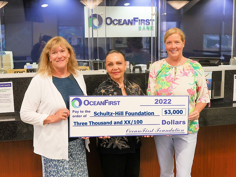 Provided/Schultz-Hill Foundation Board Member Mila McDonough (center) receives the grant from Branch Manager Colleen Manera (left) and OceanFirst Executive Director Katherine Durante (right). 