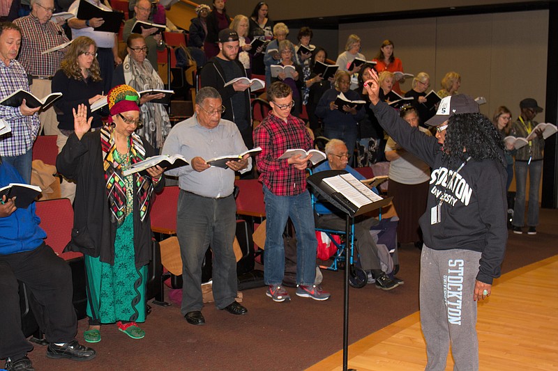 Stockton/Stockton Professor of Music Beverly Vaughn, right, leads a rehearsal of a previous year's production of Messiah.' The university is recruiting singers for this year's production.