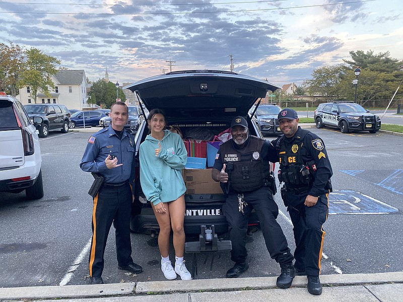 Olivia Stone delivers school supplies to Longport Police. They will be distributed in the Pleasantville schools.