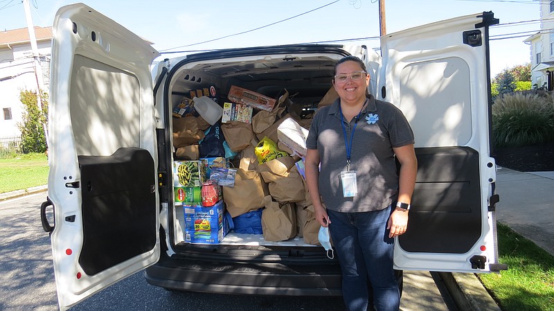 Provided/Jewish Family Service Volunteer Services Supervisor Vanessa Smith gets ready to unload the agency's van with food donated by Congregation Beth Israel. The non-perishable food will be sorted and stocked in the pantry to assist individuals and families in need in the community. 