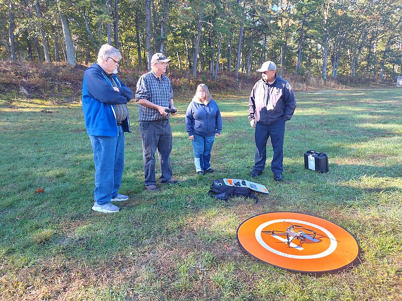 Cape May Technical High School teachers Paul Ellenberg, Christopher Jones and Julie Steratton and Instructor Jamieson Allen discuss drone technology.