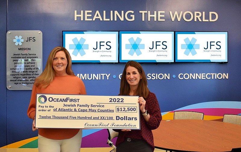 Provided/OceanFirst Foundation Executive Director Katherine Durante presents a $12,500 check to Jewish Family Service Chief Executive Officer Andrea Steinberg to support The Lynn Kramer Village by the Shore, a program that provides an array of services, programs, and socialization for older adults in the community. 