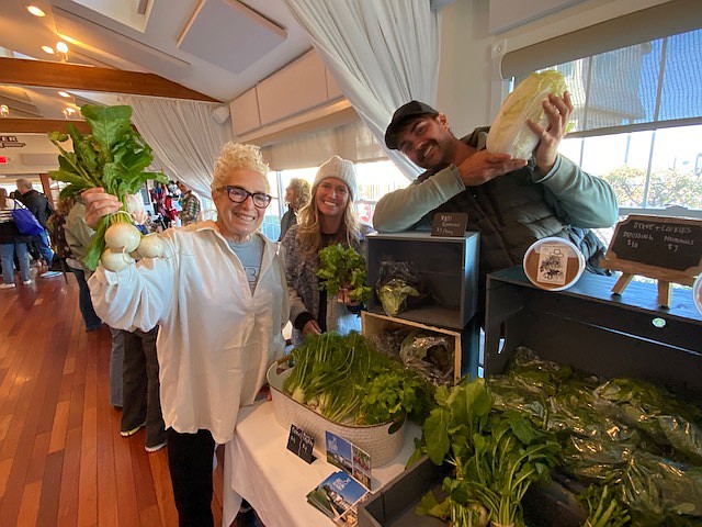 Cookie Till and staffers from Reed's Organic Farm in Egg Harbor Township sell their products at the fall farmers market in Margate.