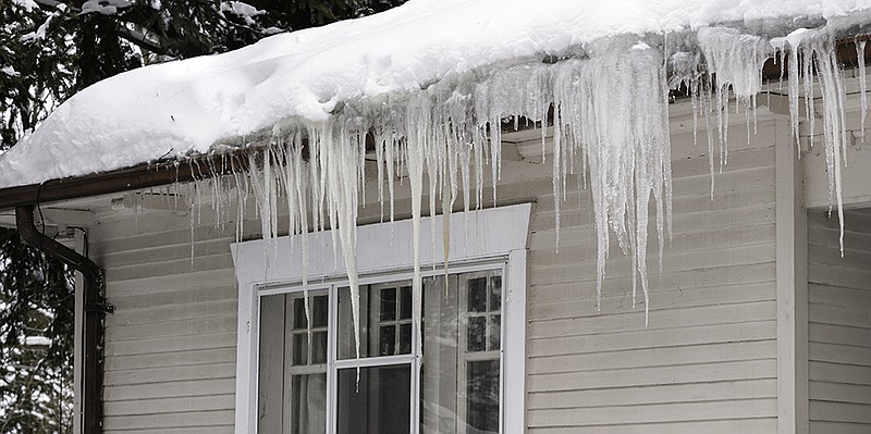 Triple-I/Clogged gutters and ice can cause serious damage to roofing systems.