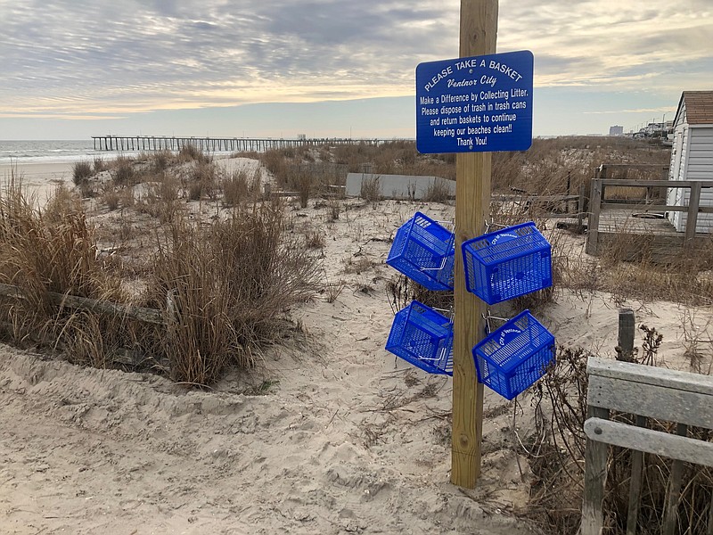 Ventnor beachgoers invited to clean the beach using blue market baskets.