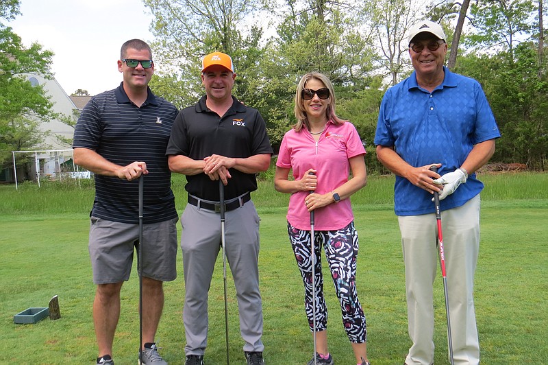 Provided by JFS/From left, Jeffrey Brook, Anthony Buccafurni, Melissa Rosenblum and Joe Jacobs hit the fairways at the JFS & JCC Golf Tournament last year. 