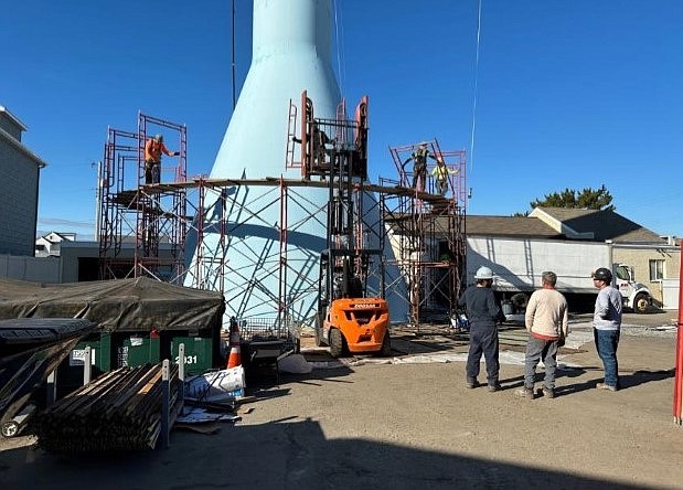 Provided/Workers are erecting scaffolding around Longport's smily-faced water tower. Painting the interior and exterior of the water tower is expected to be completed by the end of April.