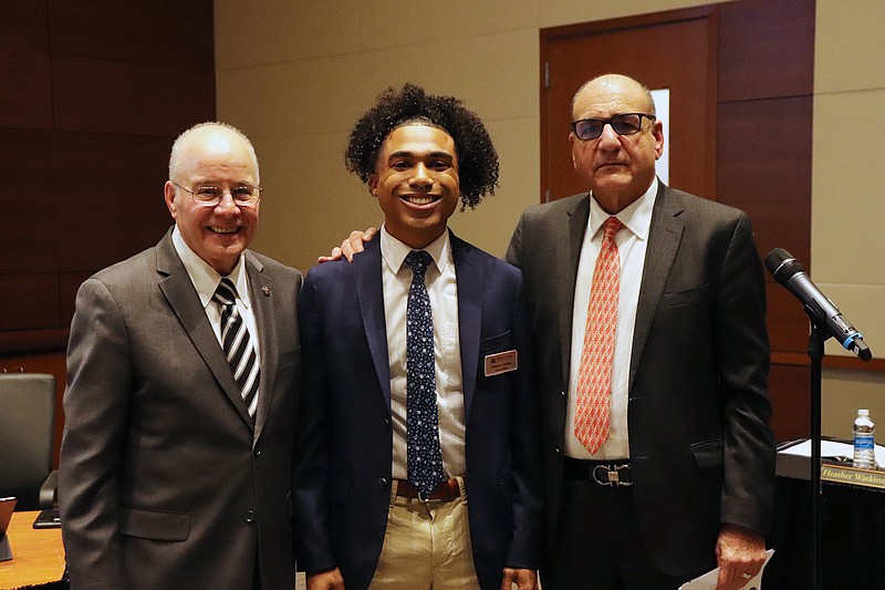 Provided?Shalayby Parsons, center, was sworn in as alternate Student Trustee at the Feb. 22 Stockton University Board of Trustees meeting. Also pictured, Stockton President Harvey Kesselman, left, and Board of Trustees Chairman Ray Ciccone, right.