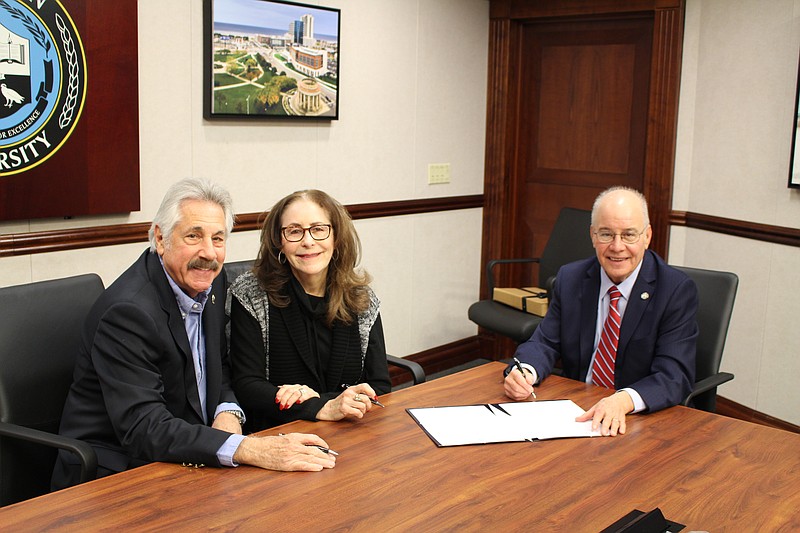 Provided/From left, Stuart and Rita Stromfeld sign an agreement establishing the Helen and Murray Fassler Memorial Endowed Holocaust Studies Scholarship with Stockton University President Harvey Kesselman.