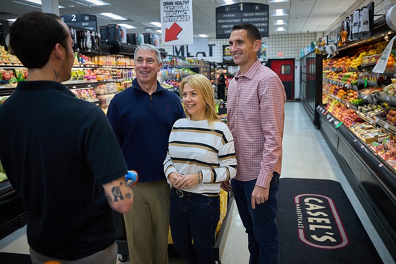 Maury Blumber, Cathy Horn and Michael Collins chat with Casel's employee Camron Crawford ahead of Mom and Pop Business Day.