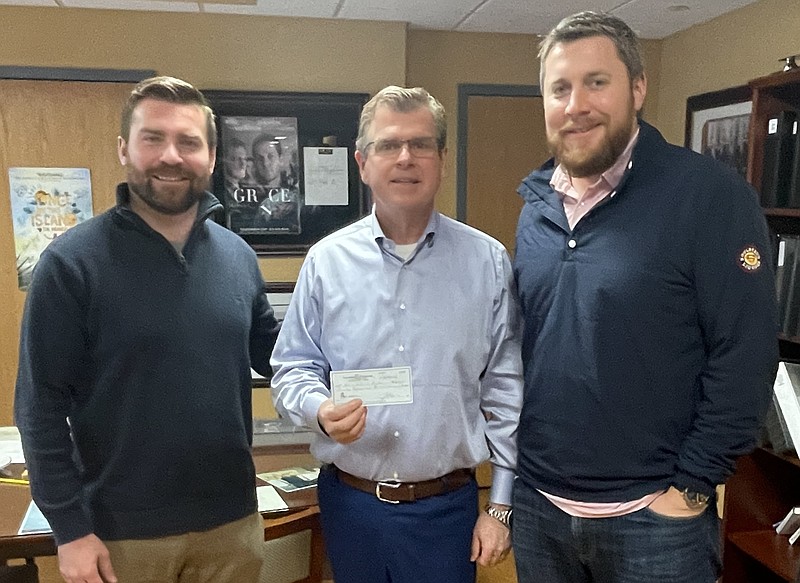 Provided/Shore Medical Center Chief Financial Officer and Chief Development Officer David Hughes, center, accepts a donation of $20,000 from OAR13 members Jason Dugan, left, and David Beyel, Jr., right, proceeds from the 2022 Kyle Evans Memorial Golf Outing.