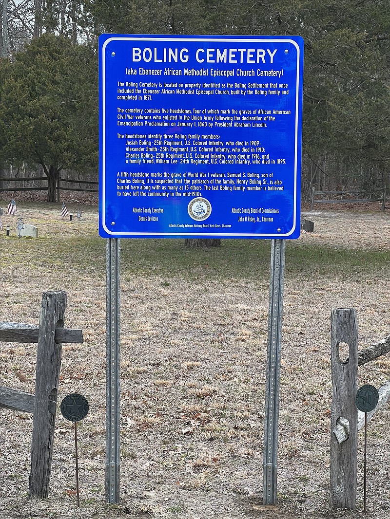 A blue sign marks the spot where several African American Civil War solderies rest.