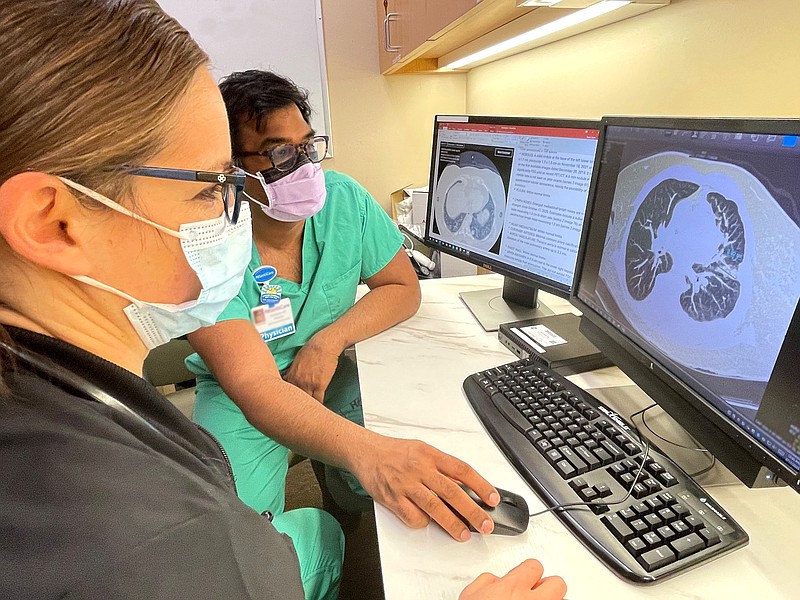 Provided/Sarah Dean, APN and Amit Borah MD view an Optellum scan.