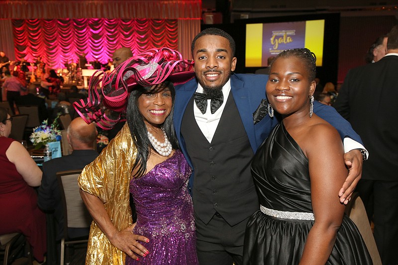 Provided/From left, Beverly Vaughn, Haashim Smith-Johnson and Shedia Laguer enjoy Stockton's 2002 Scholarship Benefit Gala.