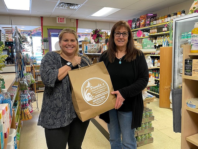 From left, JFS's Beth Joseph with Pamela Shuman of Pamela's Health & Harmony in Margate donates food to JFS 