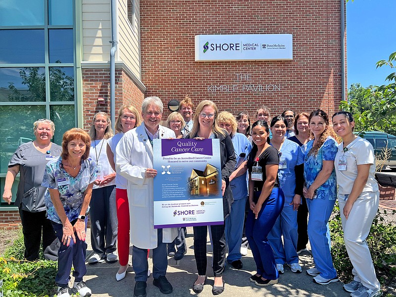 Provided/Members of the Shore Cancer Center team gathered recently to celebrate re-accreditation, including Kimberly Kaczmarski and Dr. James Pond,  pictured holding the reaccreditation poster, who spearheaded the CoC accreditation process. 