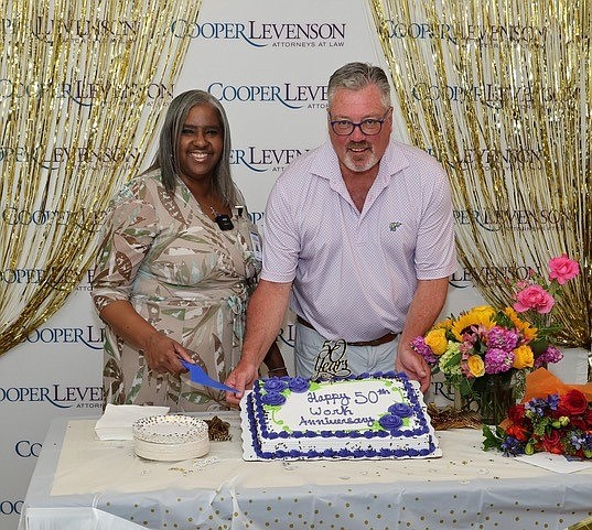 Provided/Gina Corbin with COO Ken Calemmo at a celebration of Corbin's 50th work anniversary at Cooper Levenson law firm.