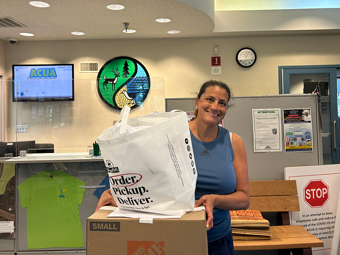 ACUA/Nicole Hyde of Angels in Motion picked up reusable bag donations at ACUA's facilities for the community members they serve.